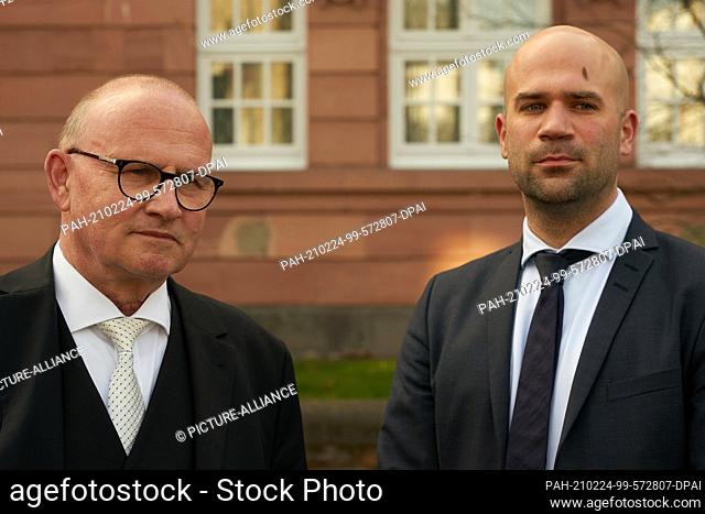 24 February 2020, Rhineland-Palatinate, Koblenz: Defense lawyers Hannes Linke (l) and Matthias Schuster talk to journalists in front of the Higher Regional...