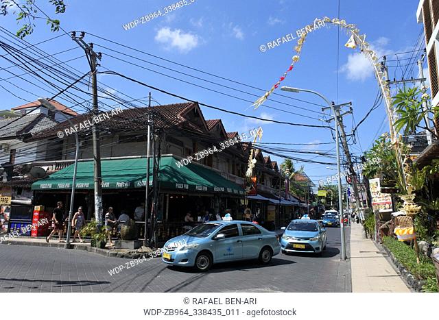 BALI - JULY 23 2019:Traffic on Seminyak town main road in Bali. Seminyak town rapidly become one of the most well-known tourist areas in Bali Indonesia