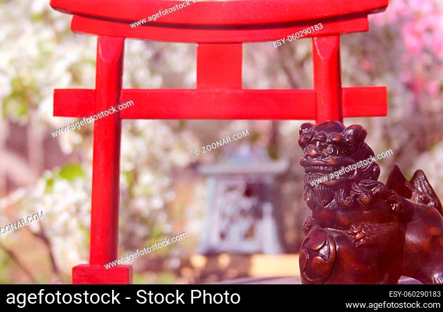 Torii Gate With Pear and Cherry Blossoms in background