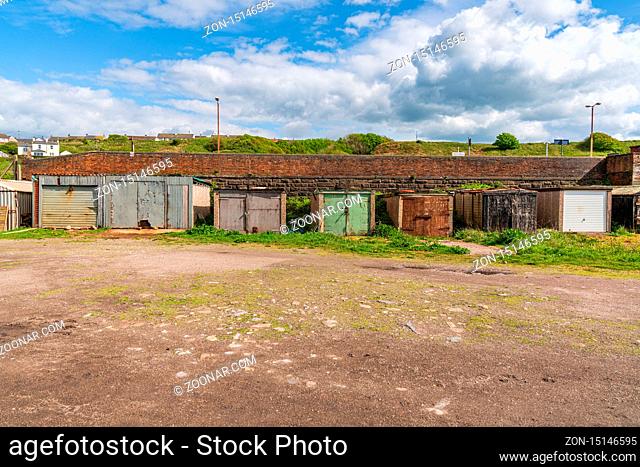 Parton, Cumbria, England, UK - May 03, 2019: Fishermen's Huts and Garages on the backside of the Railway station and near the Parton Beach