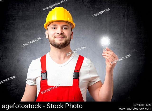 Construction worker with a glowing light bulb