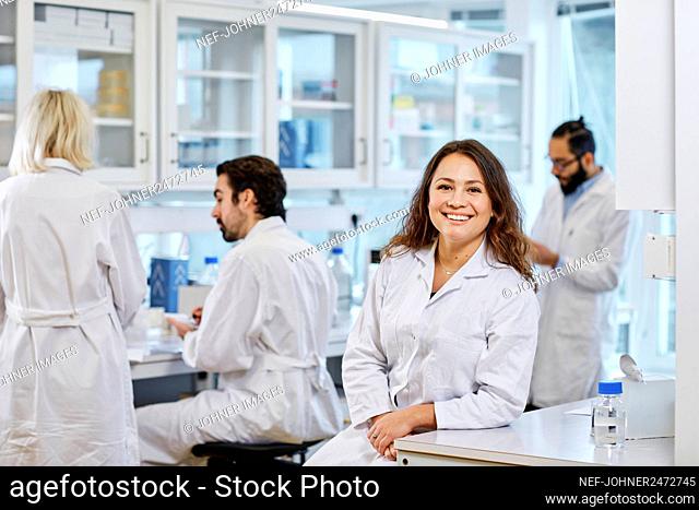 Smiling woman in laboratory