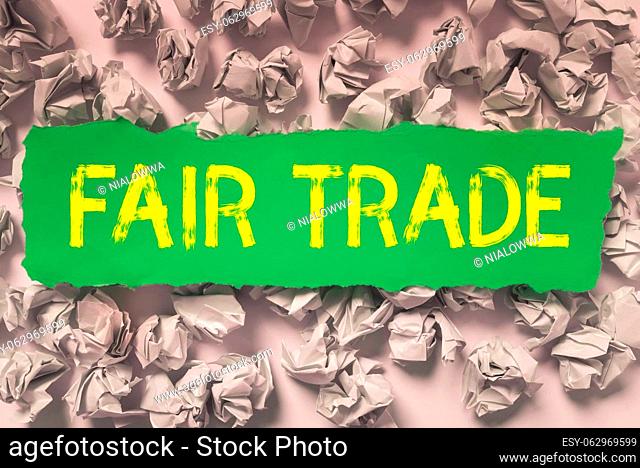 Hand writing sign Fair Trade, Word for Small increase by a manufacturer what they paid to a producer