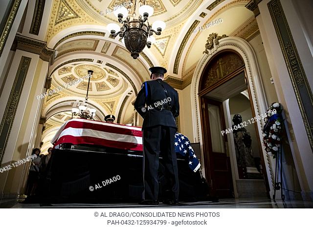 A Capitol Police honor guard stands watch over the casket of late United States Representative Elijah Cummings (Democrat of Maryland) outside the House Chamber...