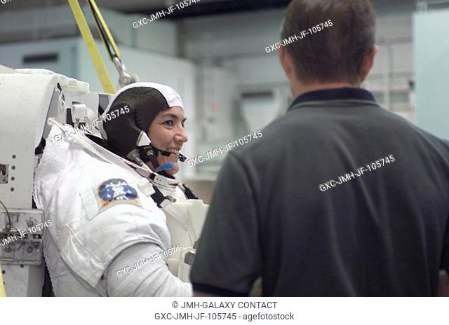 Astronaut Heidemarie M. Stefanyshyn-Piper, STS-115 mission specialist, attired in a training version of the Extravehicular Mobility Unit (EMU) space suit