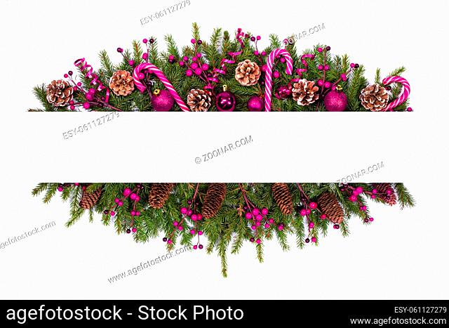 Christmas white blank card with copy space and decor of fir tree branch bauble candy cane pine cone pink holly berry isolated on white background