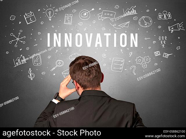 Rear view of a businessman with INNOVATION inscription, modern business concept