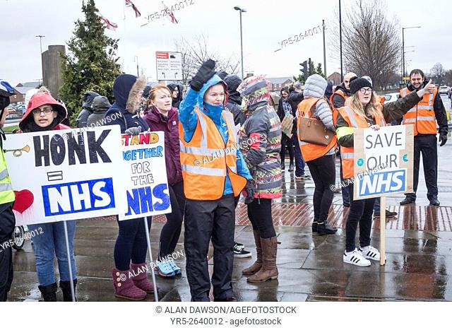 Middlesbrough, north east England, UK, 9th March 2016. Junior Doctors outside The James Cook University Hospital in Middlesbrough on a wet