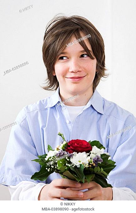 Teenager, boy, cheerfully, smiling, holds archly, flower-bouquet, sidelong glance, portrait, people, teenagers, happily, cheerfully, smiling, archly, giving