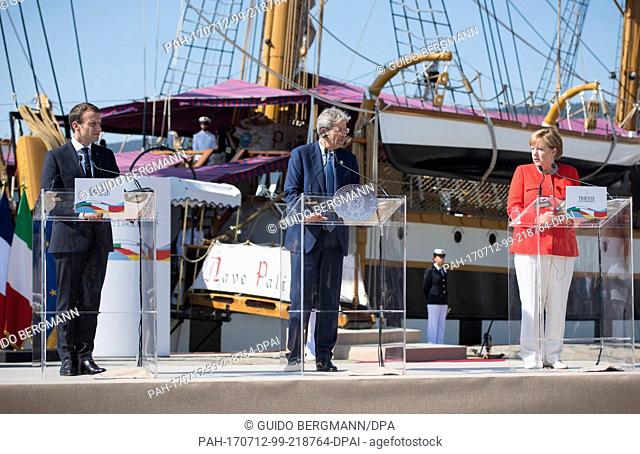HANDOUT - Handout picture dated 12 July 2017 showing German Chancellor Angela Merkel (right to left), Italian Prime Minister Paolo Gentiloni and French...