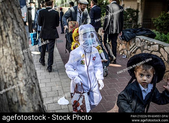 26 February 2021, Israel, Bnei Brak: Costumed Jewish children take part in celebrations marking Purim, also called the Festival of Lots