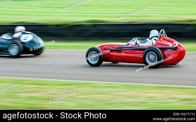 GOODWOOD, WEST SUSSEX/UK - SEPTEMBER 14 : Vintage Racing at Goodwood on September 14, 2012. Two unidentified people