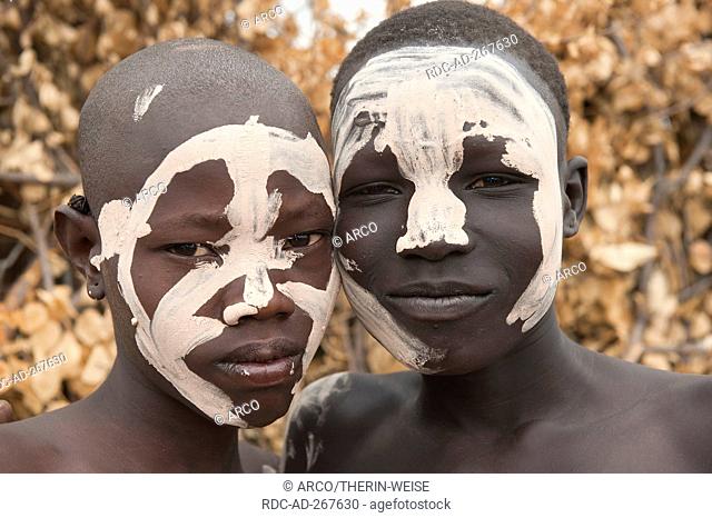 Nyangatom boys with painted faces, Omo river Valley, Ethiopia / Bume, Buma, Bumi