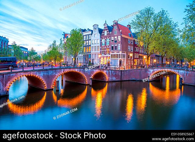 Bridge over Keizersgracht - Emperor's canal in Amsterdam, The Netherlands at twilight. HDR image