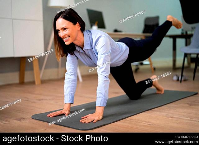Yoga Leg Workout In Office Near Desk And Computer
