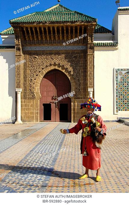 Water seller at entrance gate of mausoleum Moulay Ismail Meknes Morocco