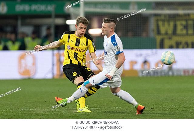Dortmund's Matthias Ginter (L) and Lotte's Andre Dej vie for the ball during the German DFB Cup soccer match between SF Lotte and Borussia Dortmund at the...
