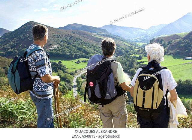Hikers looking out over valley