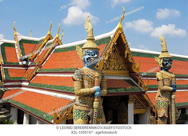 Mythical giants guarding one of the entrances to Wat Phra Kaew  Bangkok, Thailand