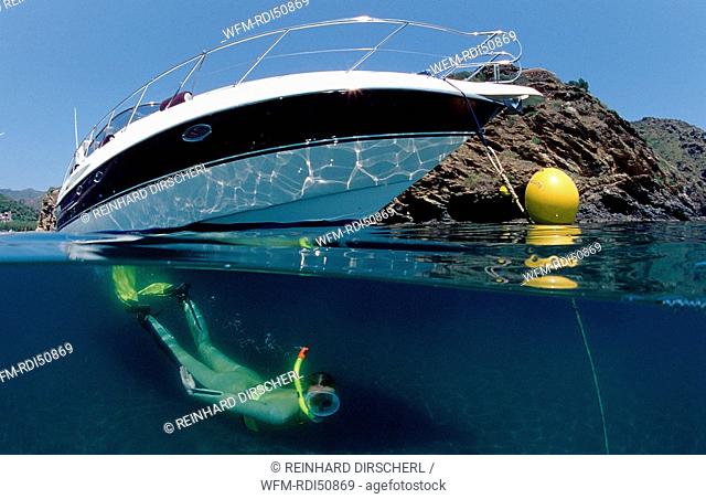 Skin diving in front of a yacht split image, Mediterranean Sea Costa Brava, Spain