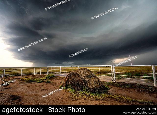 Tornado over field with lightning in Elmer, Oklahoma, United States
