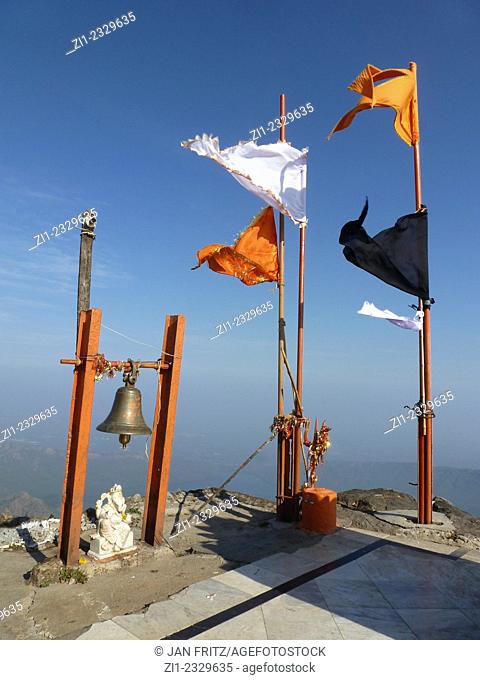 flags on top of jain neminath temple at mount girnar with 10.000 steps in Gujarat, India
