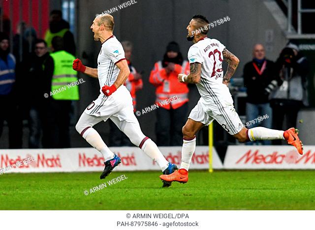 Munich's Arjen Robben (l) and Arturo Vidal celebrate the 0:2 goal during the Bundesliga soccer match between FC Ingolstadt 04 and Bayern Munich at the Audi...