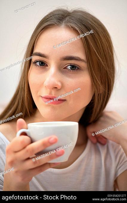 Girl With Cup Of Coffee In The Bedroom