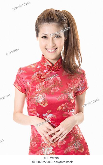 Smiling Chinese woman dress traditional cheongsam at New Year, studio shot isolated on white background