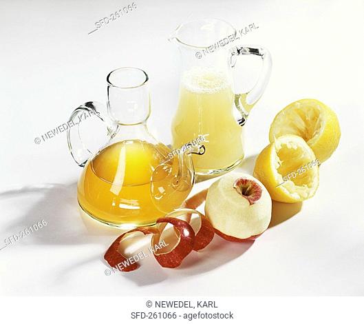 Apple vinegar and lemon vinegar in carafes