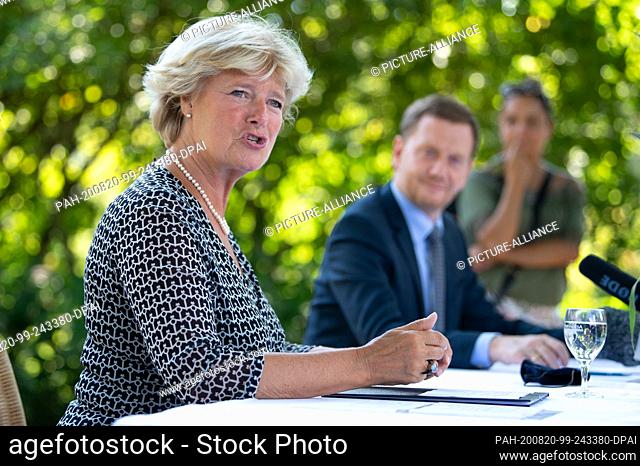 20 August 2020, Saxony, Bad Muskau: Monika Grütters (CDU, l), Minister of State for Culture, speaks at a press conference in Fürst-Pückler-Park next to Michael...