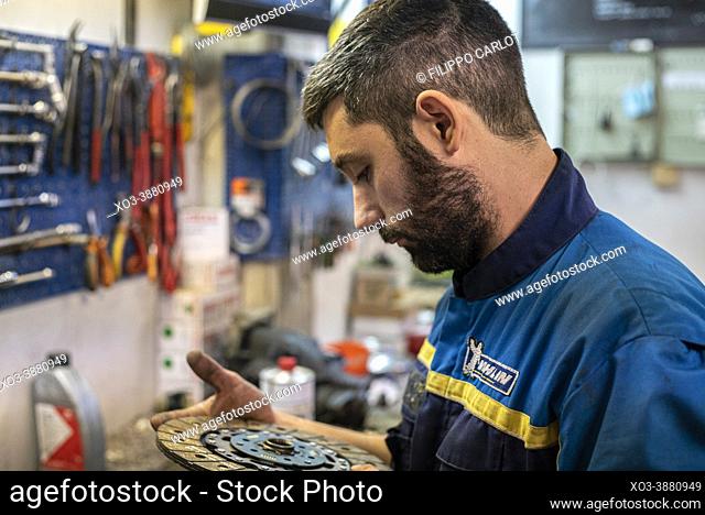 MILAN, ITALY: Mechanic at work in the workshop