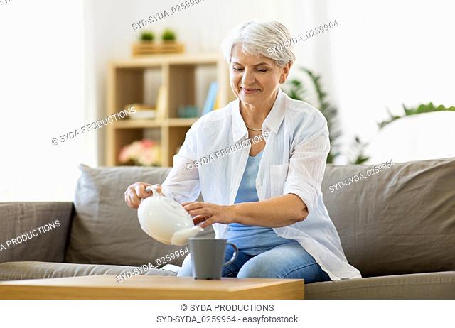 senior woman drinking tea at home