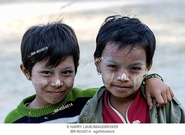 Two children with Thanaka paste on their faces, in Bagan, Myanmar