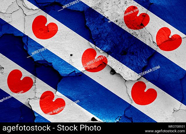 flag of Friesland painted on cracked wall
