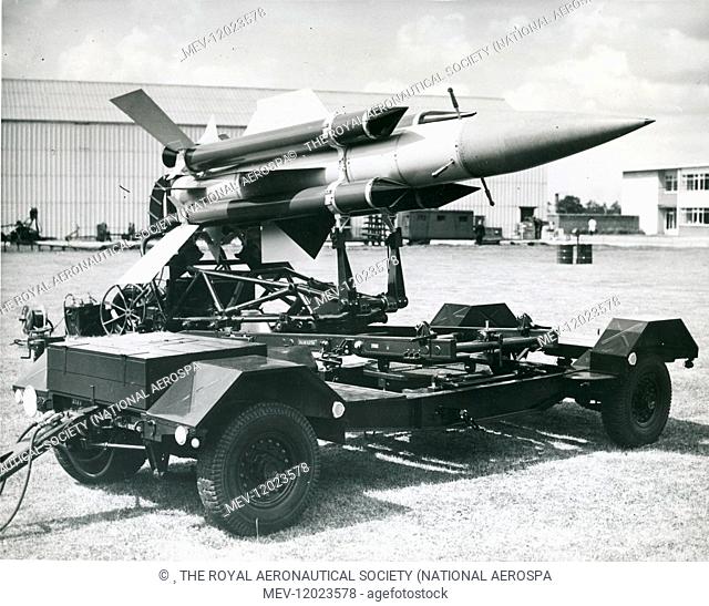 An English Electric Thunderbird surface-to-air guided missile being transferred from the launcher-loading trolley to the launcher, September 1958