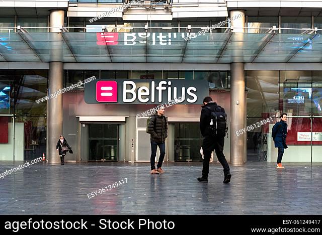 Saint-Josse, Brussels Capital Region - Belgium Employees and pedestrians of the Belfius Banking company going to work