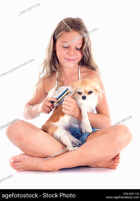 young girl and chihuahua in front of white background