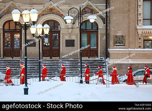 RUSSIA, RYBINSK - DECEMBER 16, 2023: Performers dressed in Father Frost (Russian Santa Claus) costumes are seen in Red Square before the start of a parade of...