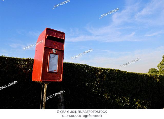 Traditional red post box at the village of Redhill, Somerset England, United Kingdom
