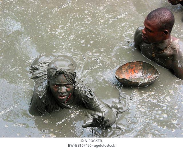 Voodoo follower in mud in Plaine du Nord, Haiti, Plaine du Nord