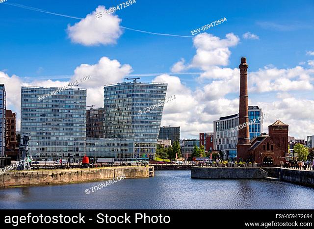 LIVERPOOL, UK - JULY 14 : Old and new buildings in the docks, Liverpool, England on July 14, 2021