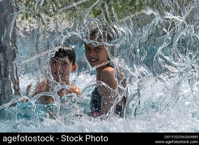 Ceremony opening of summer swimming pool Mikulov Riviera in Mikulov, Czech Republic, June 30, 2023. Pictured children under water mushroom umbrella