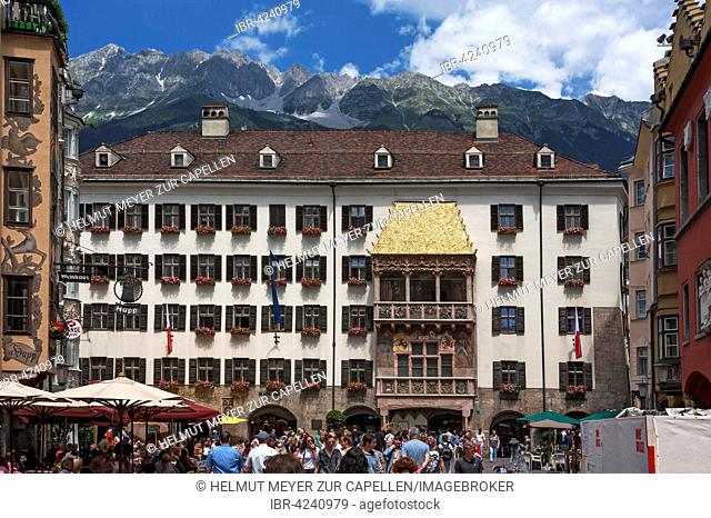 Goldenes Dachl or Golden Roof, late gothic alcove balcony, mountains behind, Innsbruck, Tyrol, Austria