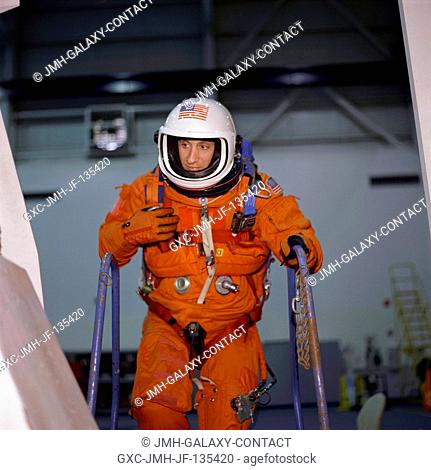 Astronaut Charles O. Hobaugh, STS-104 pilot, watches a crew mate in a life raft during an emergency bailout training session in the Neutral Buoyancy Laboratory...
