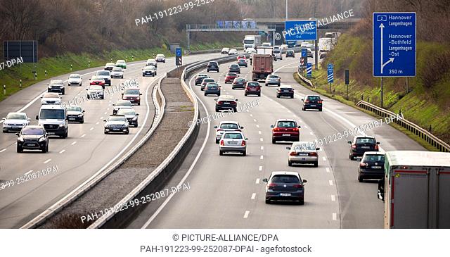 23 December 2019, Lower Saxony, Hanover: Vehicles, including a police emergency vehicle, drive along the Autobahn 2. Photo: Moritz Frankenberg/dpa