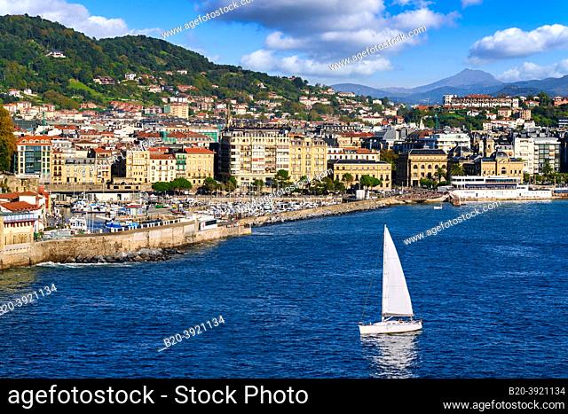 Sailboat sailing through La Concha Bay, Port and Old Town, View from Santa Clara Island, Donostia, San Sebastian, Basque Country, Spain, Europe