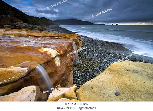 Water-stained sandstone on Seven Mile Beach, South Island, New Zealand, Pacific