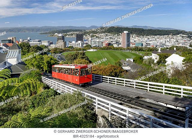 Wellington Cable Car on railway track, funicular railway, harbour and city center behind, Wellinton, New Zealand