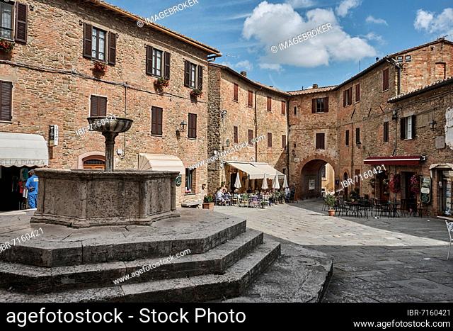Piazza Umberto I, fountain and street cafe, Panicale, Perugia region, Umbria, central Italy, Italy, Europe